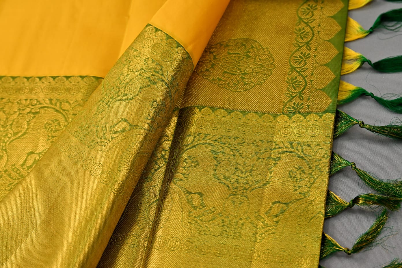 Pure silk kanchipuram plain in yellow with green color saree - Vannamayil Fashions