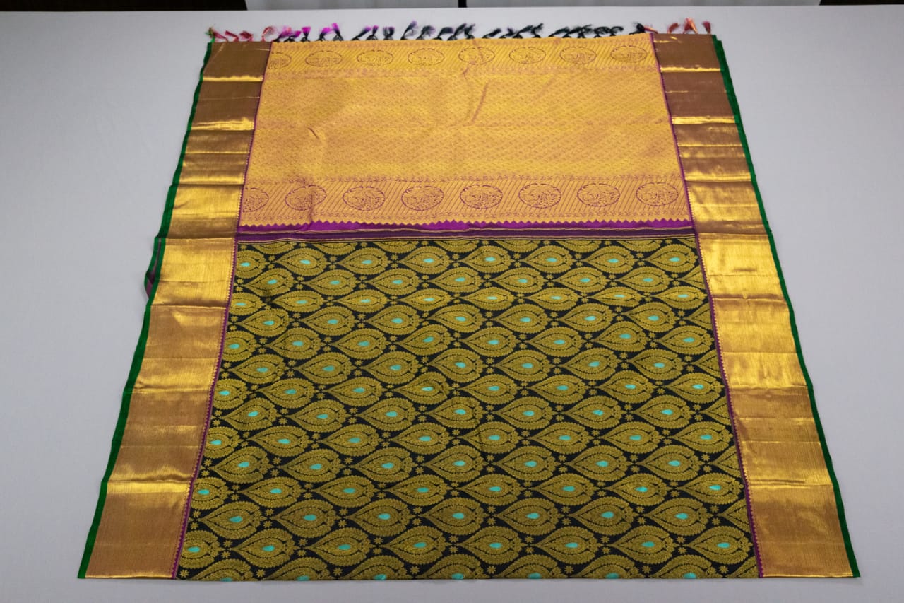 Borderless peach semi-soft silk saree with circle buttas, contrast pallu of  floral & paisley designs
