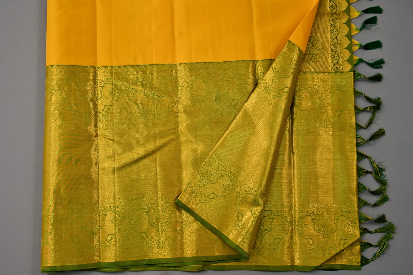 Pure silk kanchipuram plain in yellow with green color saree - Vannamayil Fashions