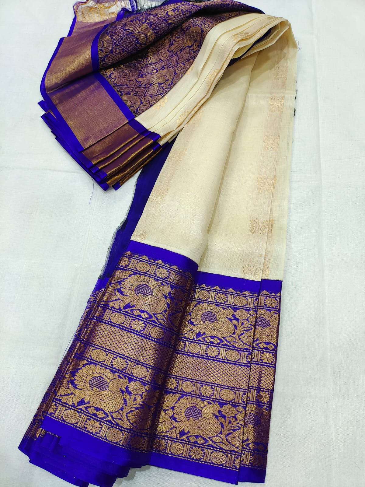 Multi Colour fancy tussar saree with ikkat-style intricate checked design  on its body, contrast big border & plain pallu