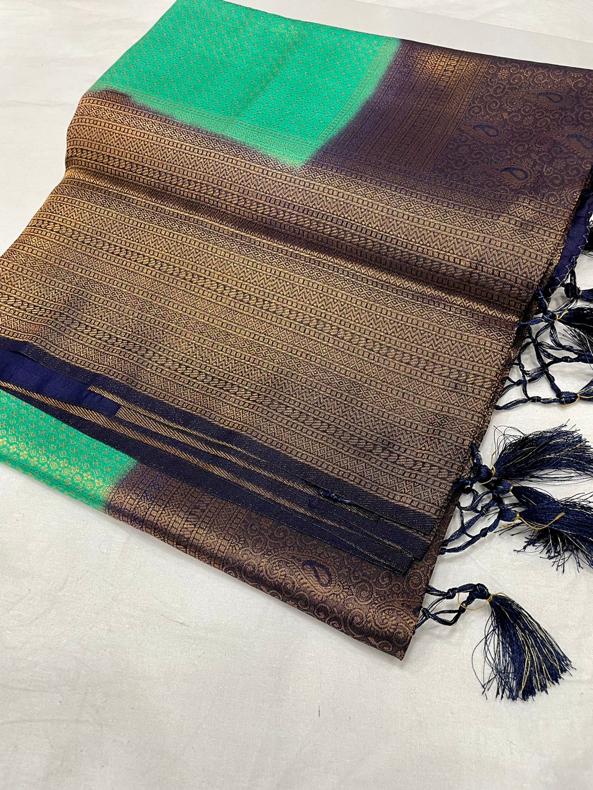 Kubera soft silk rich copper zari pencil design saree