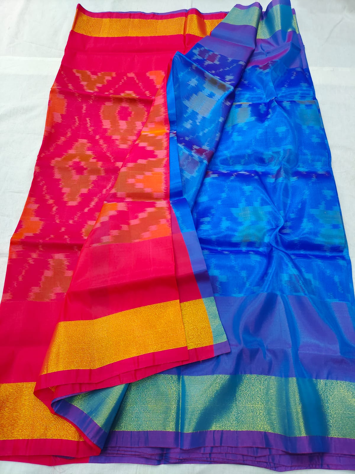 Leaf Green Ikkat Saree with all-over ikkat buttas, contrast border & pallu  of intricate ikkat style designs